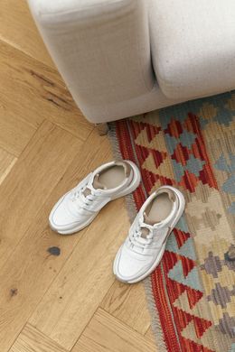 Кросівки білі фото